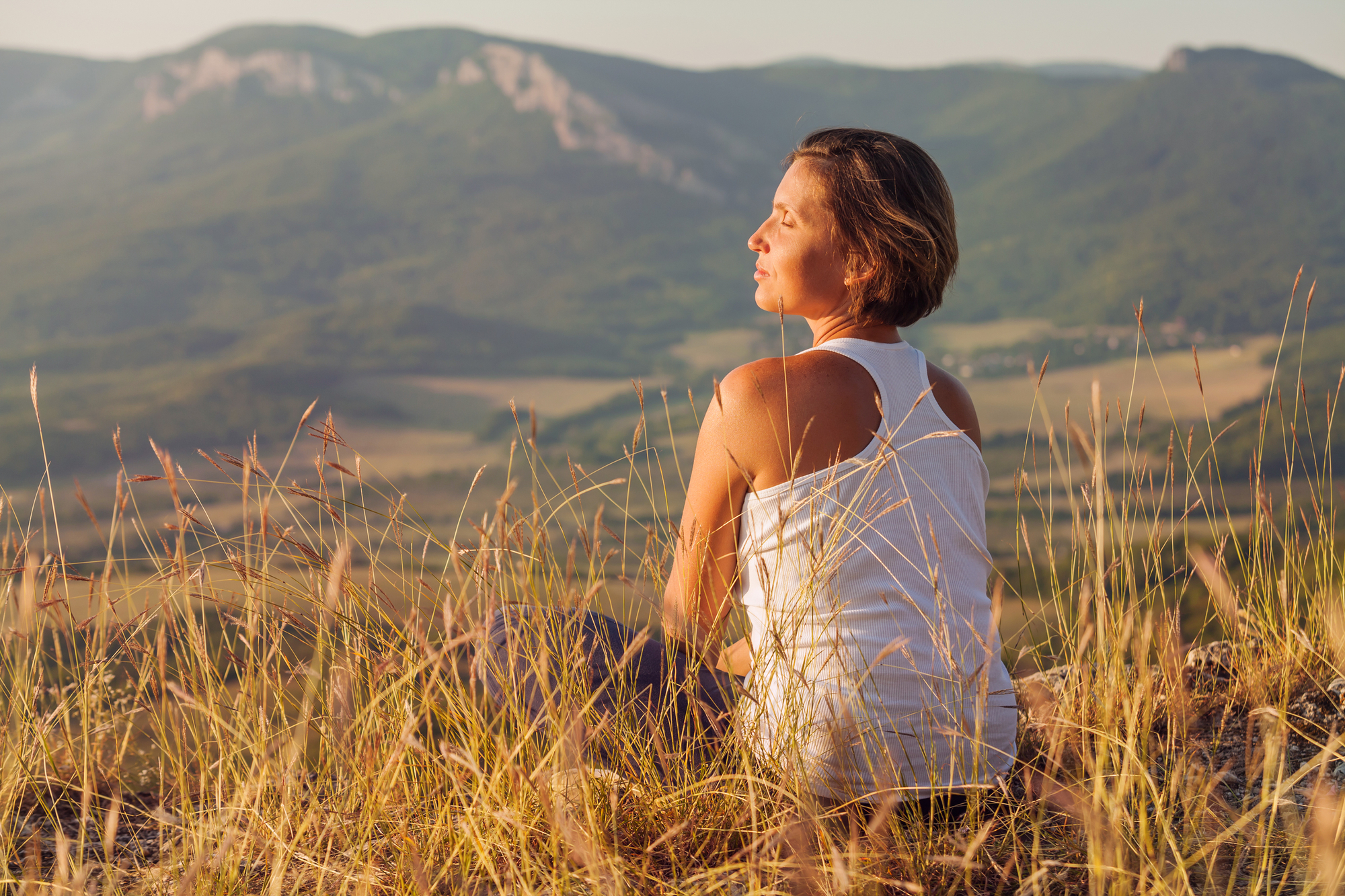 Woman Sitting On Grass